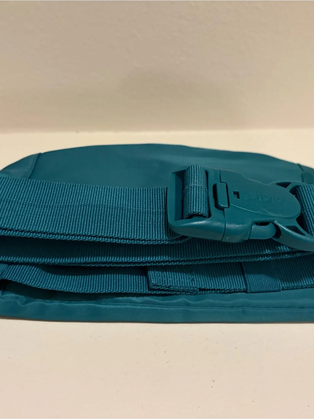 The Foldie Teal Waist Crossbody Bag RFID Blocking Travel Hand Free NWT